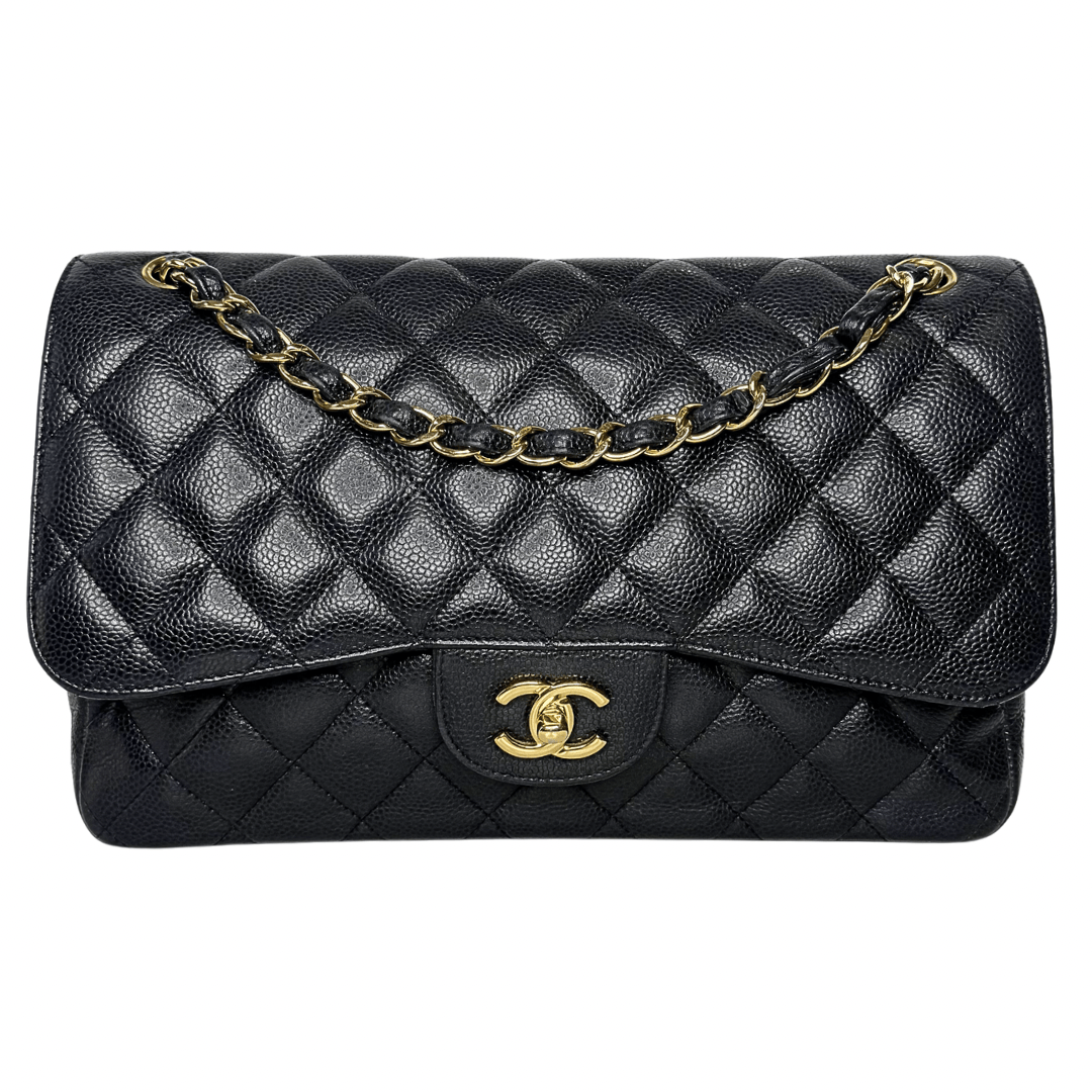 Black quilted handbag with gold chain and clasp on a white background