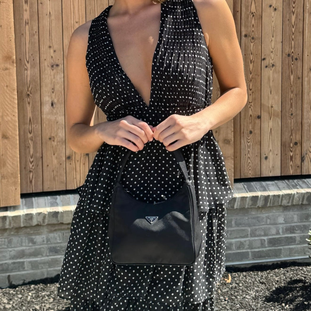 woman holding Prada Nylon Tessuto Sport Mini Bag